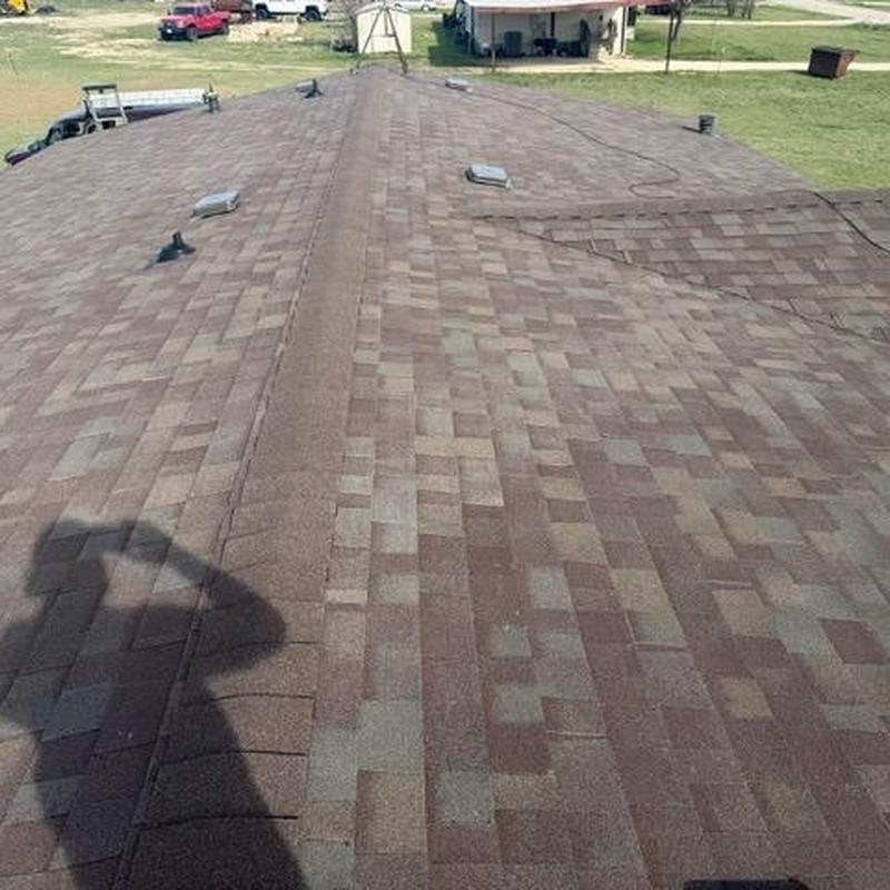 Asphalt shingle roof with ridge vent installation
