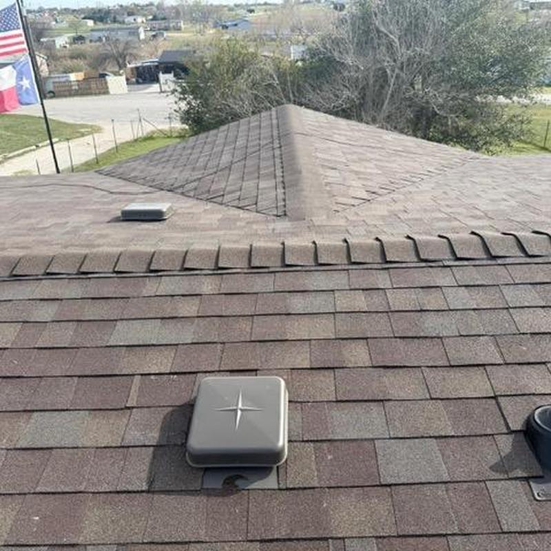 Asphalt shingle roof with vent covers installed
