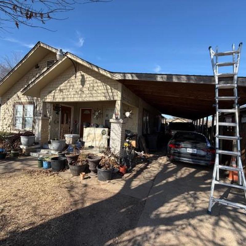 Roof shingles inspection with ladder by carport Fort Worth TX