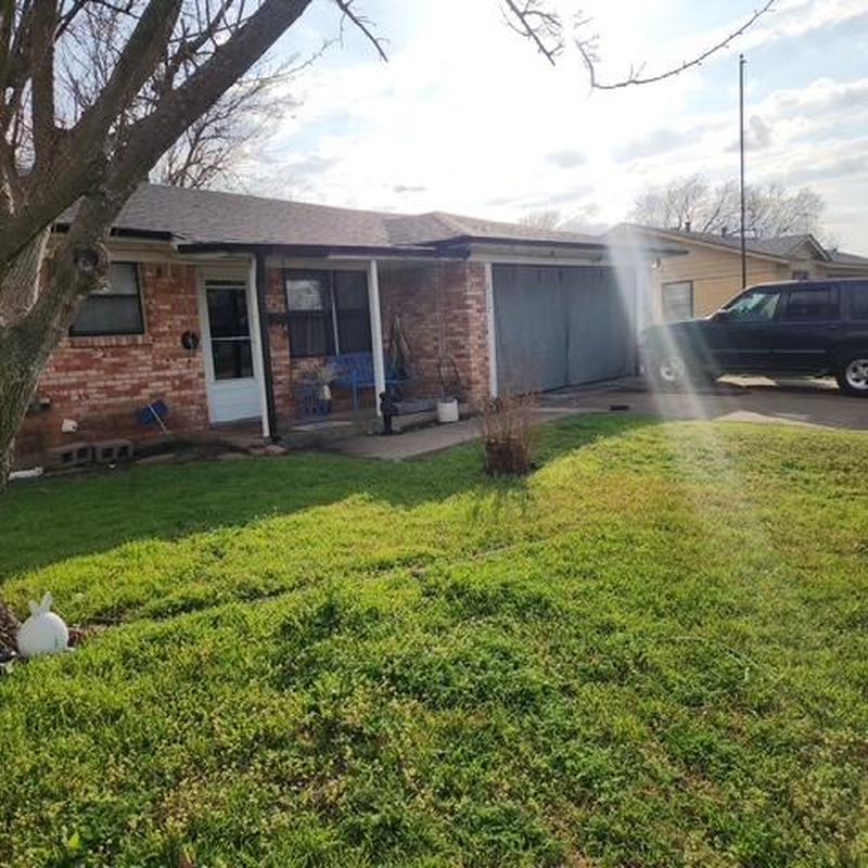 New gutter installation on brick house exterior
