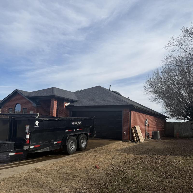 New dark shingle roof on brick house in Mansfield TX