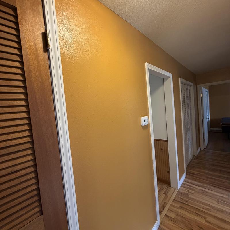 Sheetrock wall with textured paint in hallway