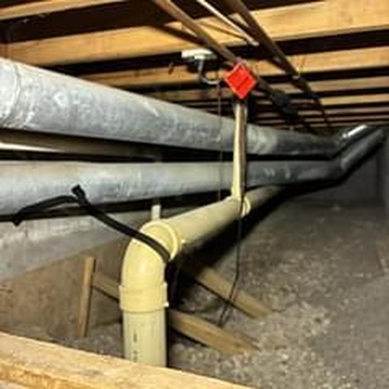 Drain pipe descaling with flex shaft machine in crawl space