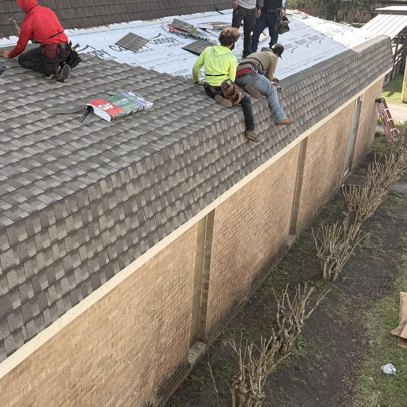 Asphalt shingle roof installation on residential building