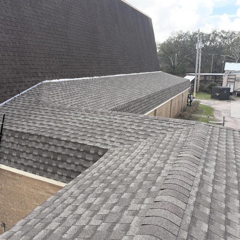 Asphalt shingle roof with ridge cap installation