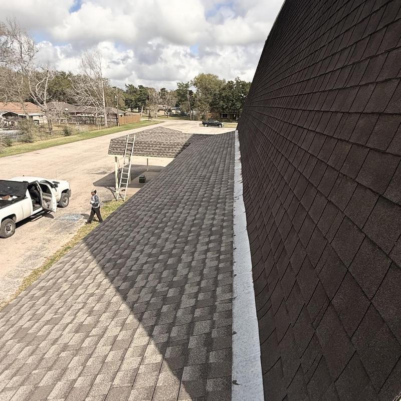 Asphalt shingle roof with ridge cap installation