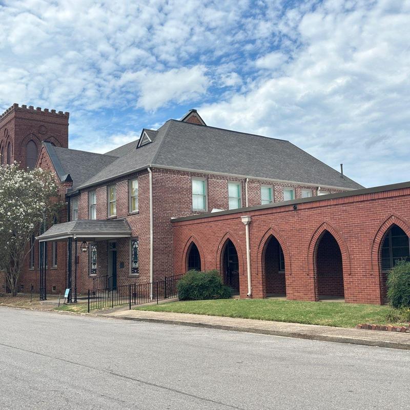 Asphalt shingle roof on historic brick building
