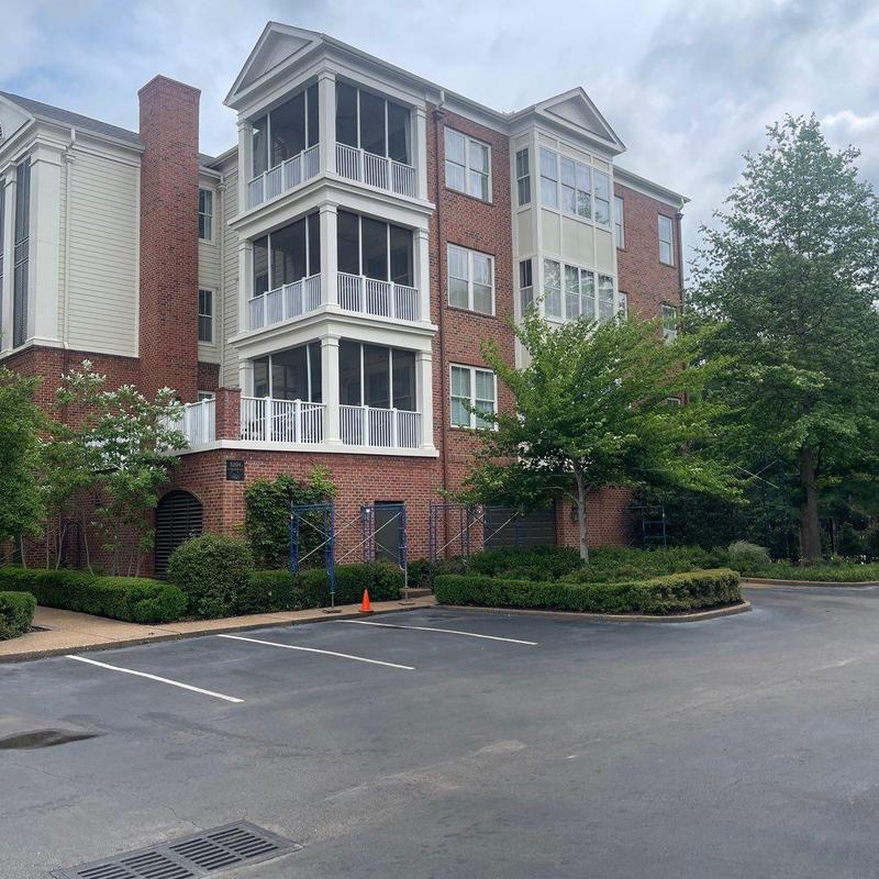 Asphalt shingle roof with scaffolding setup