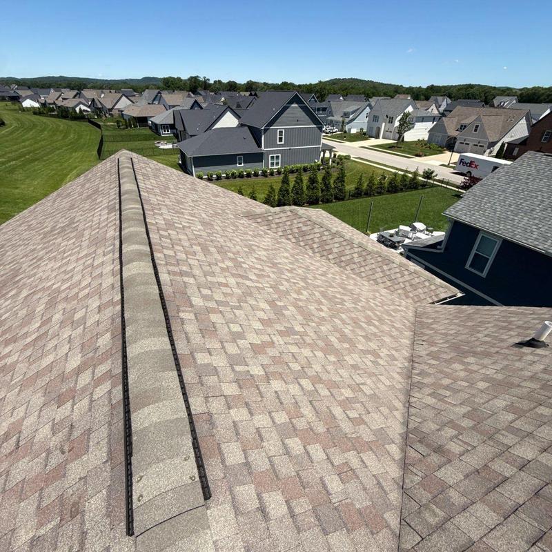 Asphalt shingle roof with ridge vent inspection