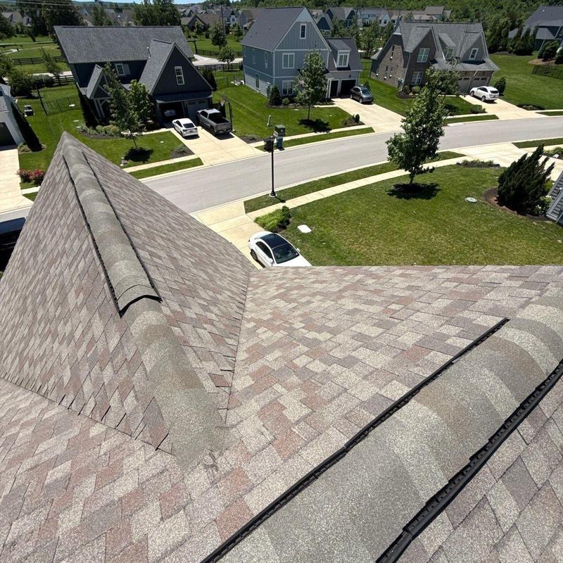 Asphalt shingle roof with ridge and ventilation details
