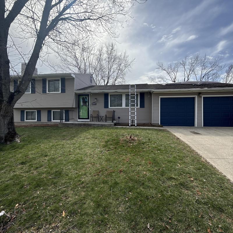 Asphalt shingle roof with ladder for storm inspection Asphalt shingle roof with ladder for storm inspection