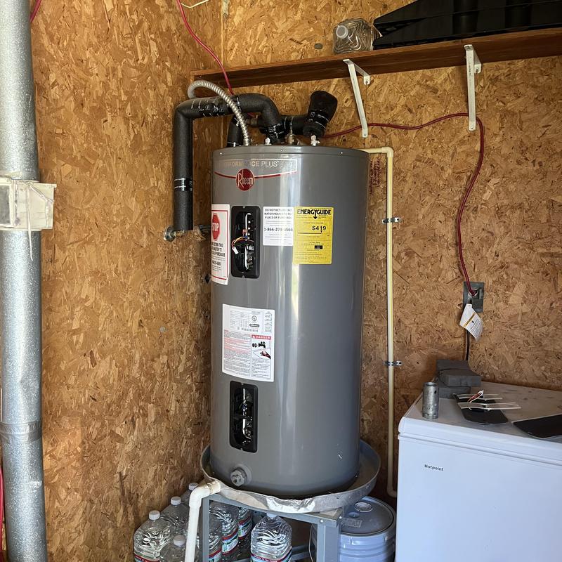 Water heater with replaced thermostats and heating elements