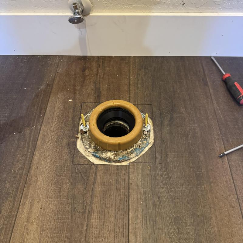 Toilet flange installed in bathroom floor remodeling