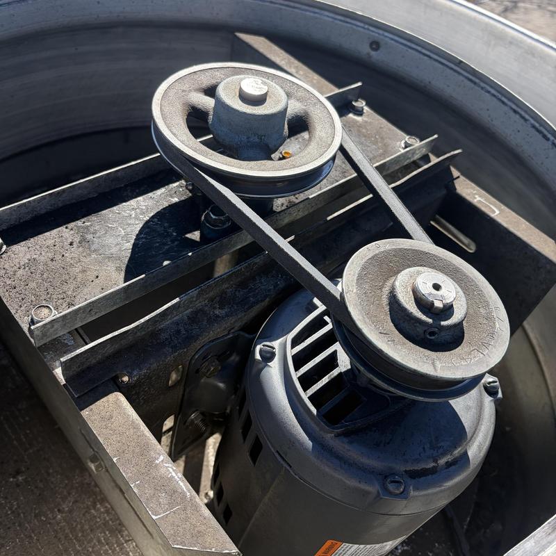 HVAC motor and belt drive system in rooftop unit