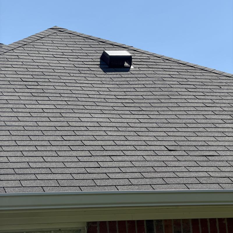 Stove exhaust vent with roof vent cap installed