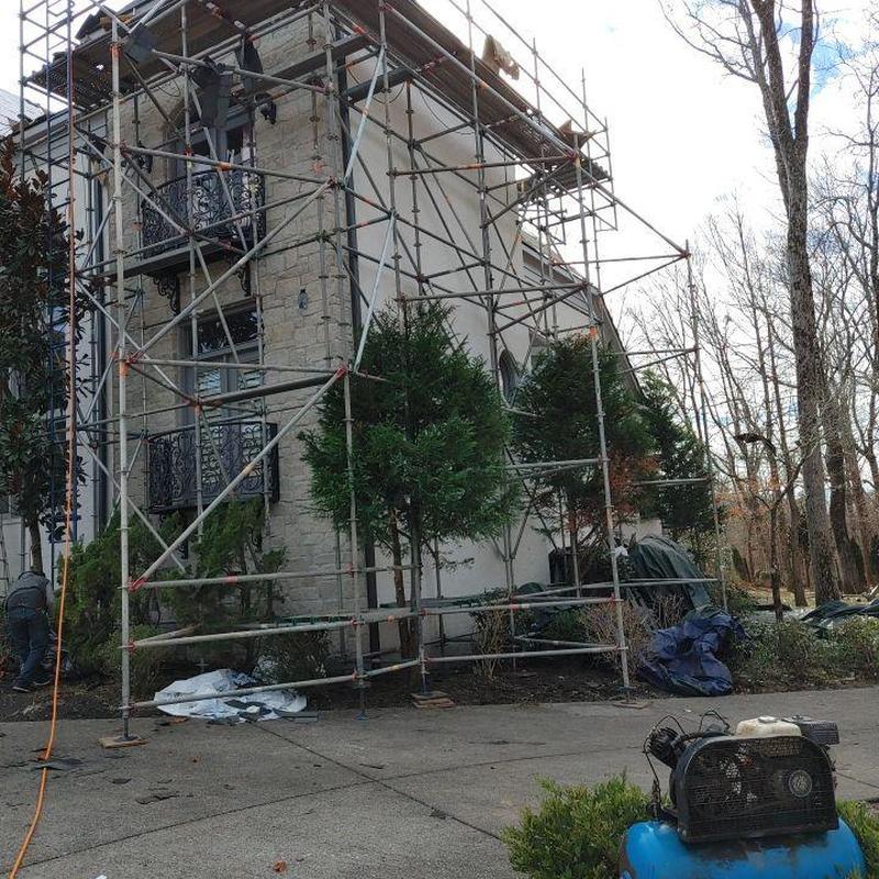 Asphalt designer shingles installation scaffolding setup