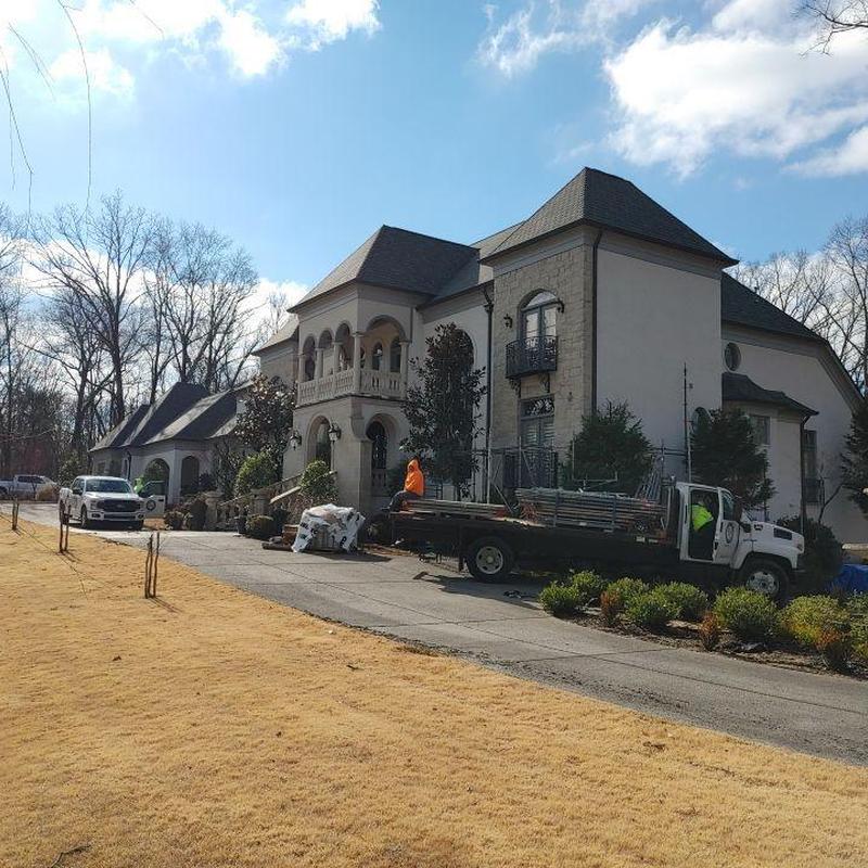 Asphalt designer shingle roof with scaffolding setup
