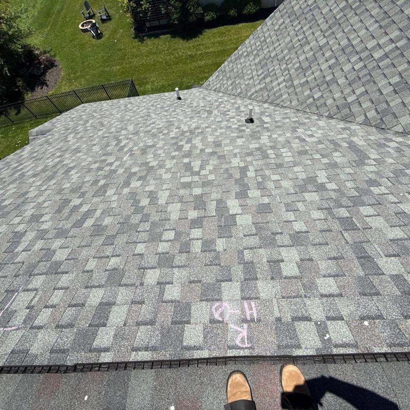 Asphalt shingle roof with hail damage markings