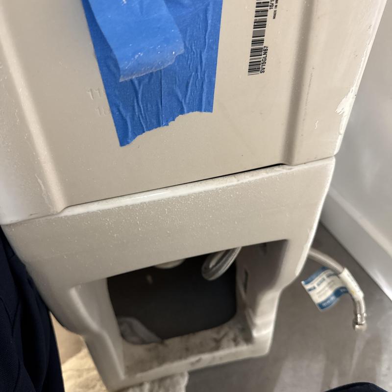 Toilet base with new wax ring and fill valve installed