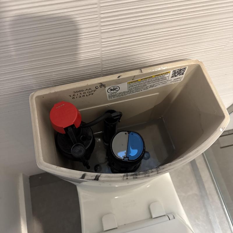 Toilet fill valve and flush valve inside tank