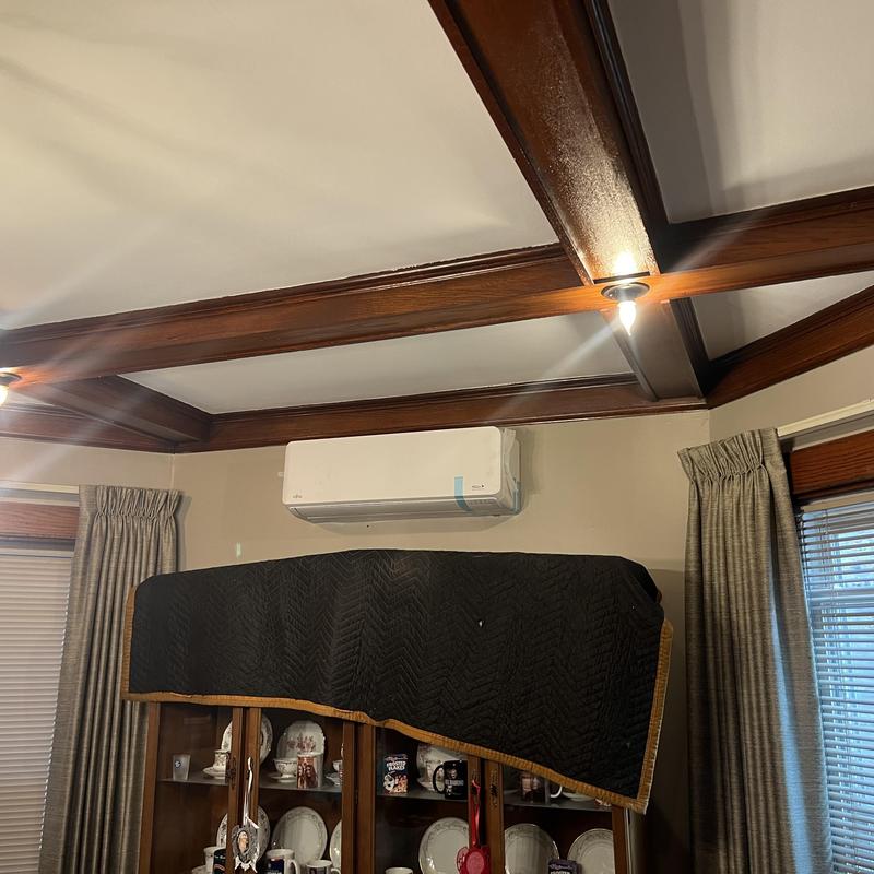 Ductless mini-split air conditioner mounted on wall