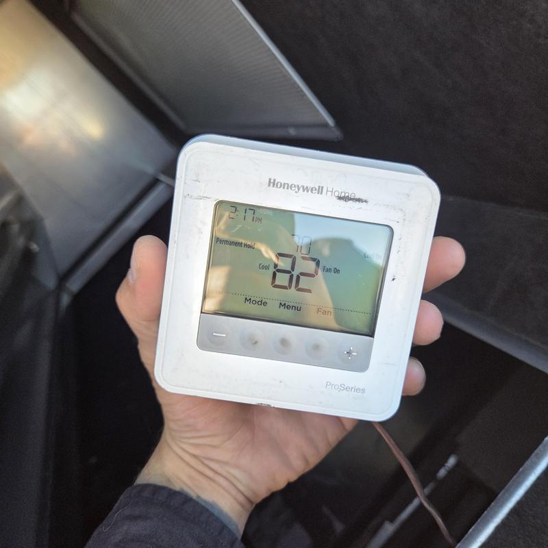Honeywell Home thermostat display set to 82 degrees