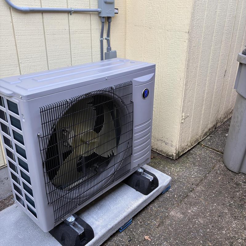 High efficiency heat pump unit installed outdoors High efficiency heat pump unit installed outdoors