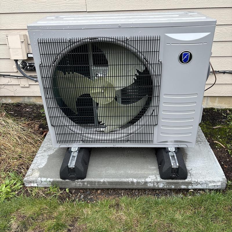 Friedrich heat pump outdoor unit on concrete pad Friedrich heat pump outdoor unit on concrete pad