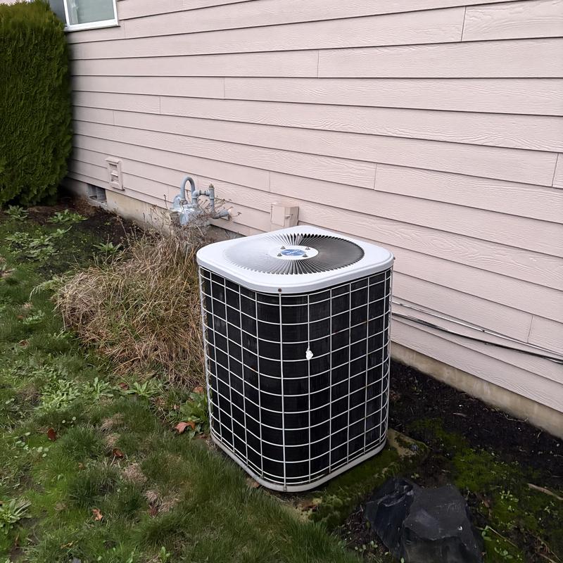 Friedrich heat pump unit outside home in yard Friedrich heat pump unit outside home in yard