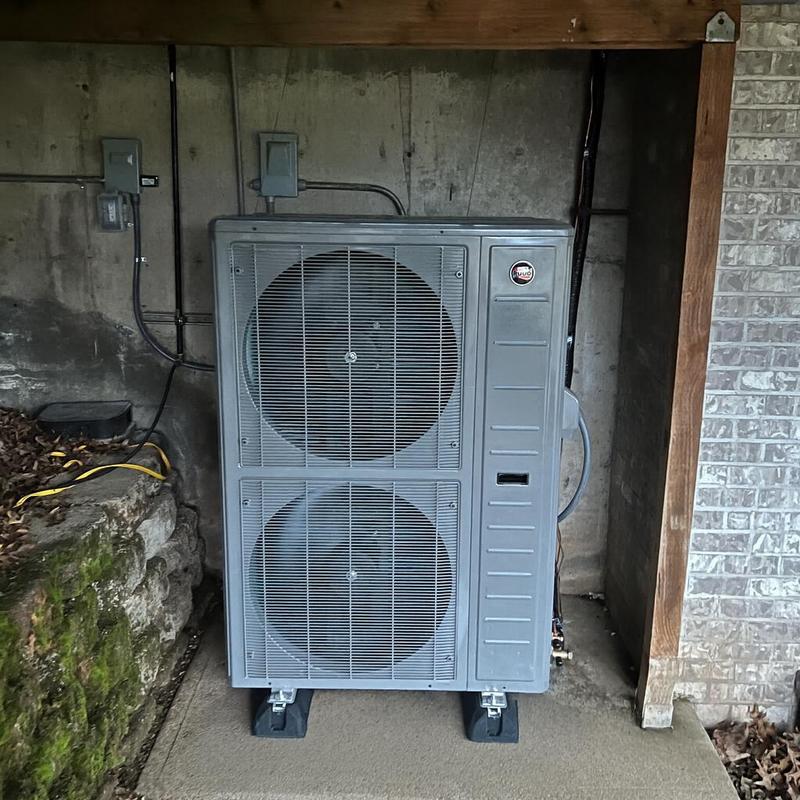 Ruud heat pump with dual fans installed outdoors Ruud heat pump with dual fans installed outdoors