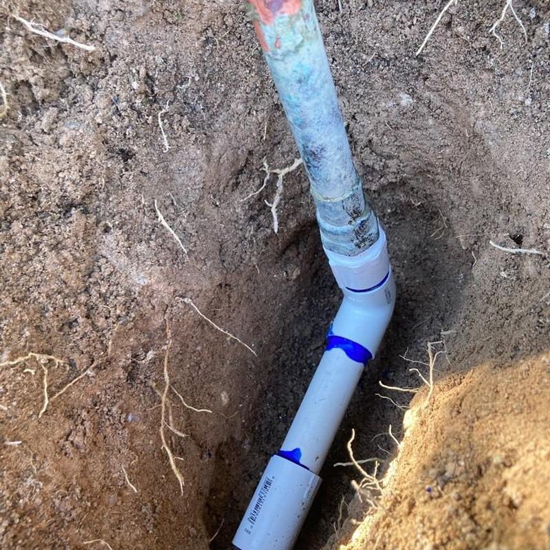 PVC irrigation water line with new fittings in trench