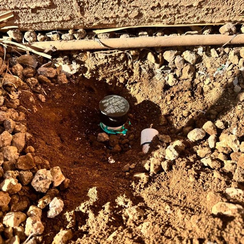 Copper water supply line capped underground near wall Copper water supply line capped underground near wall