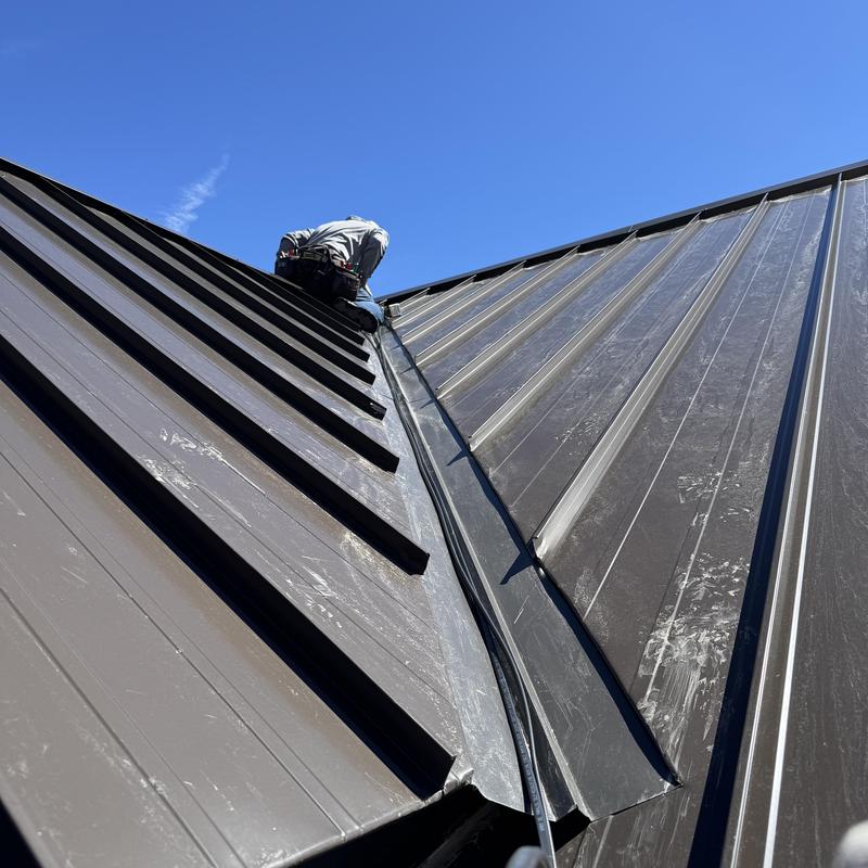 Metal roof snow guard and heat tape installation on roof Metal roof snow guard and heat tape installation on roof