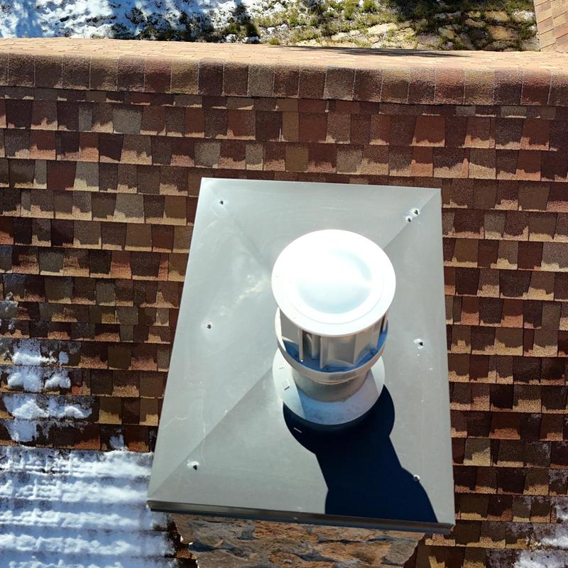 Chimney vent cap on asphalt shingle roof Chimney vent cap on asphalt shingle roof
