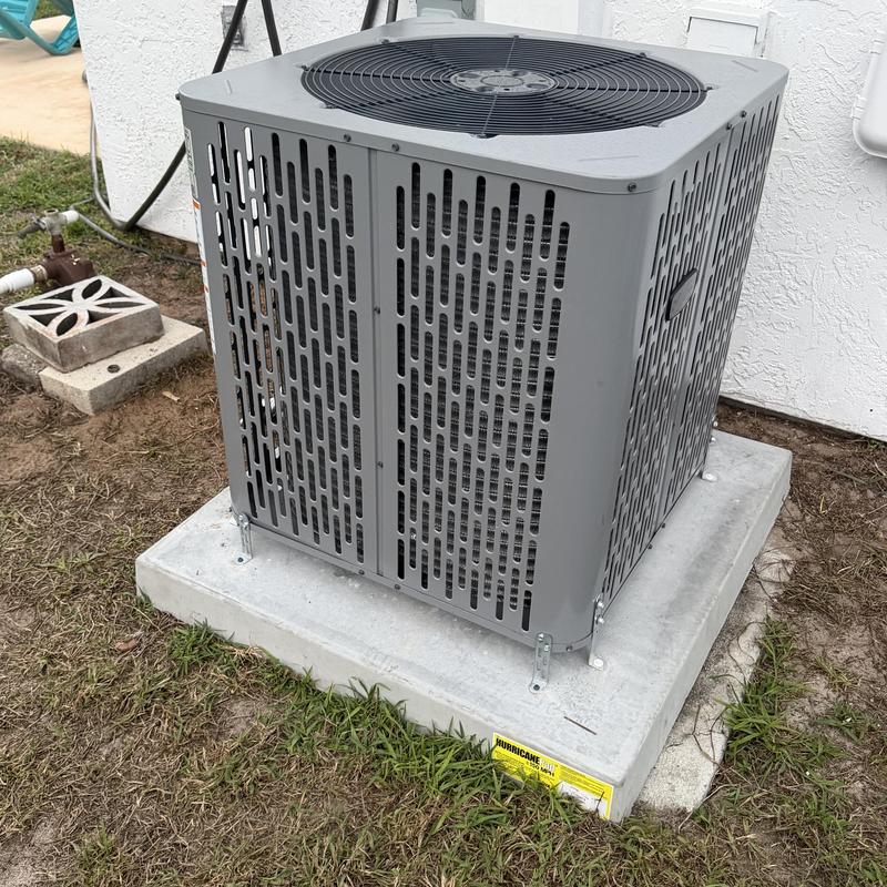 16 SEER Trane air conditioner unit on concrete pad