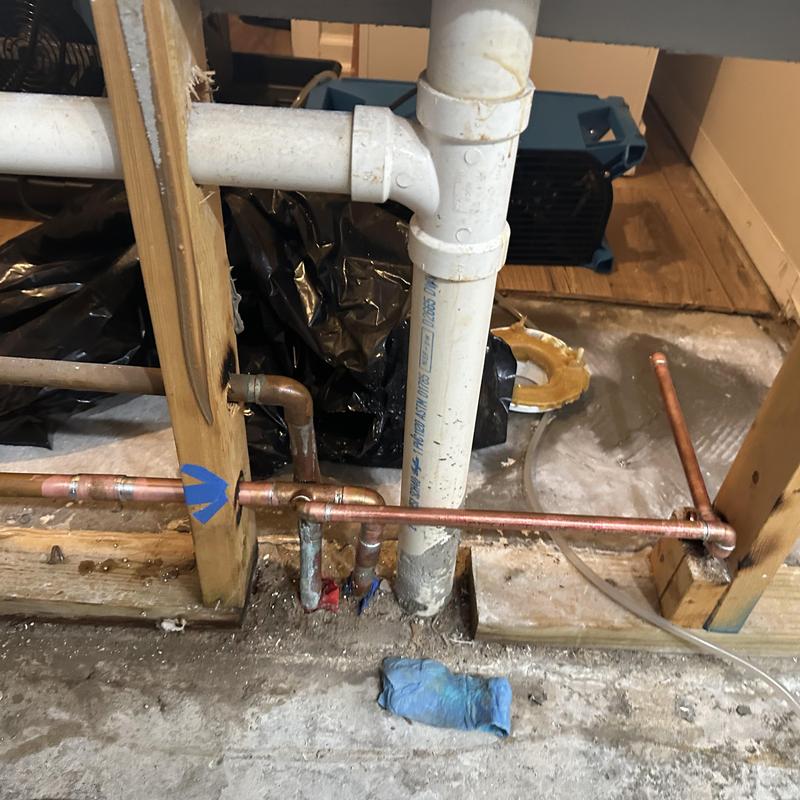 Copper water supply pipe installation in wall cavity