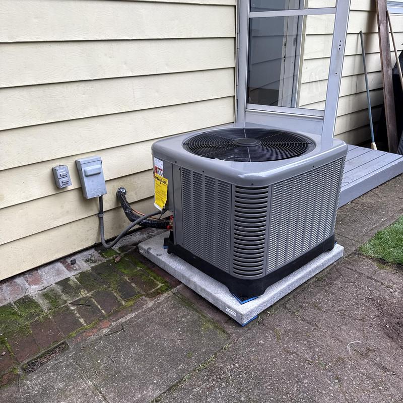 Ruud air conditioning unit installed on patio slab Ruud air conditioning unit installed on patio slab