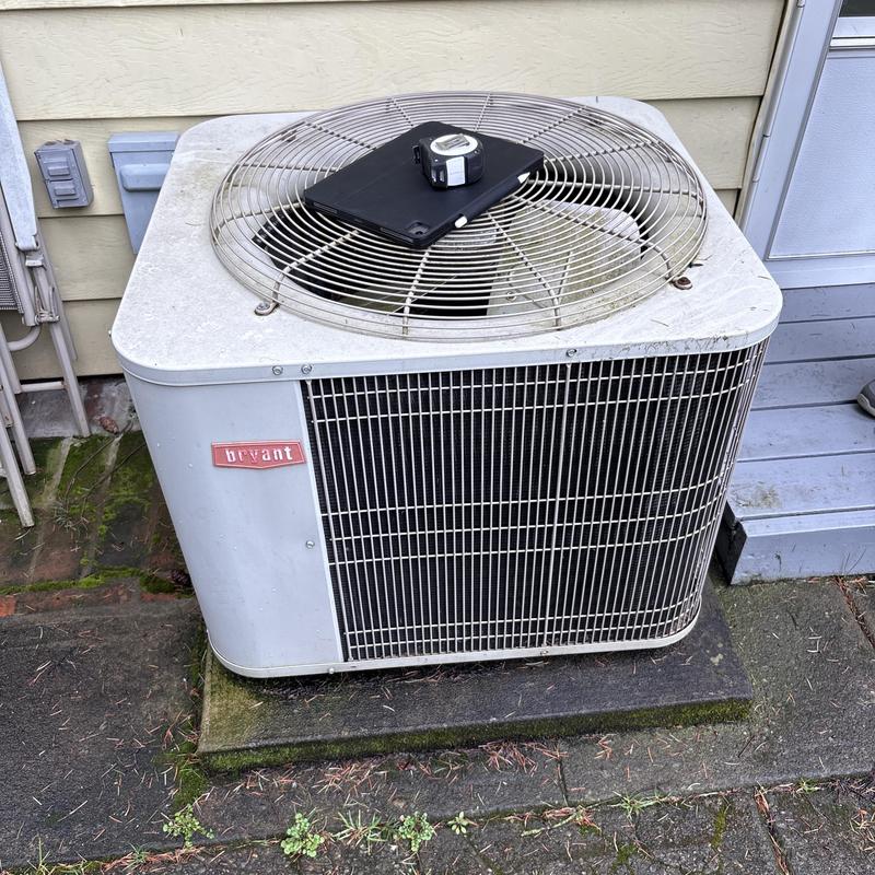 Bryant outdoor air conditioning unit with tools on top Bryant outdoor air conditioning unit with tools on top