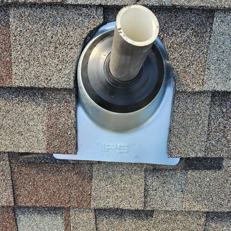 Concave plumbing boot on asphalt shingle roof