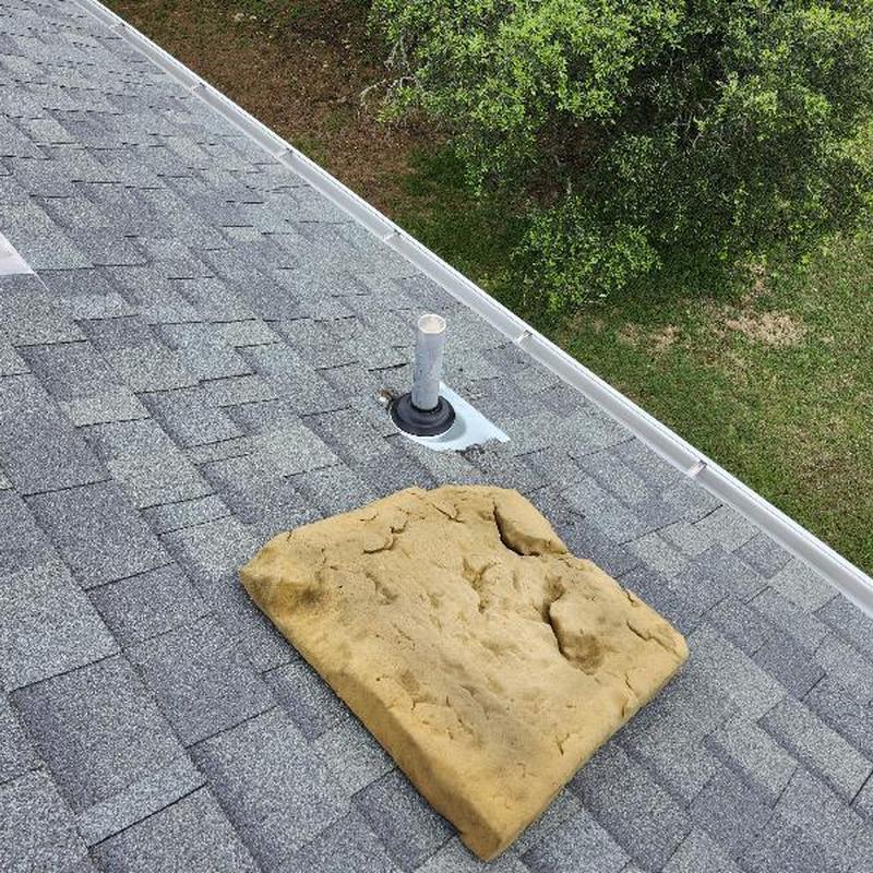 Plumbing boot installed on gray shingle roof