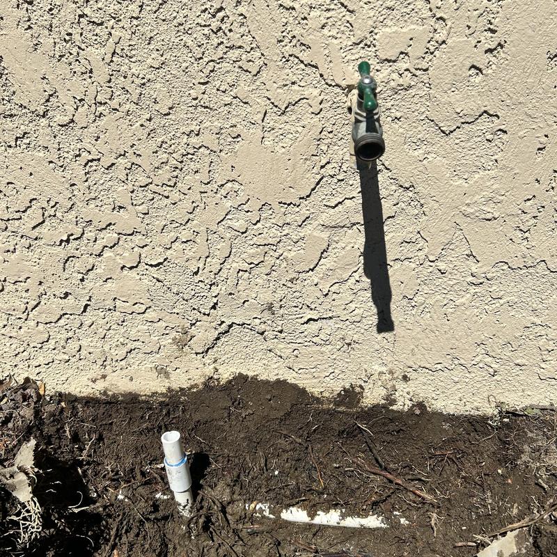Outdoor irrigation pipe and faucet installation in dirt