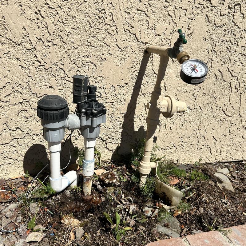 Pressure reducing valve with irrigation and pressure gauge