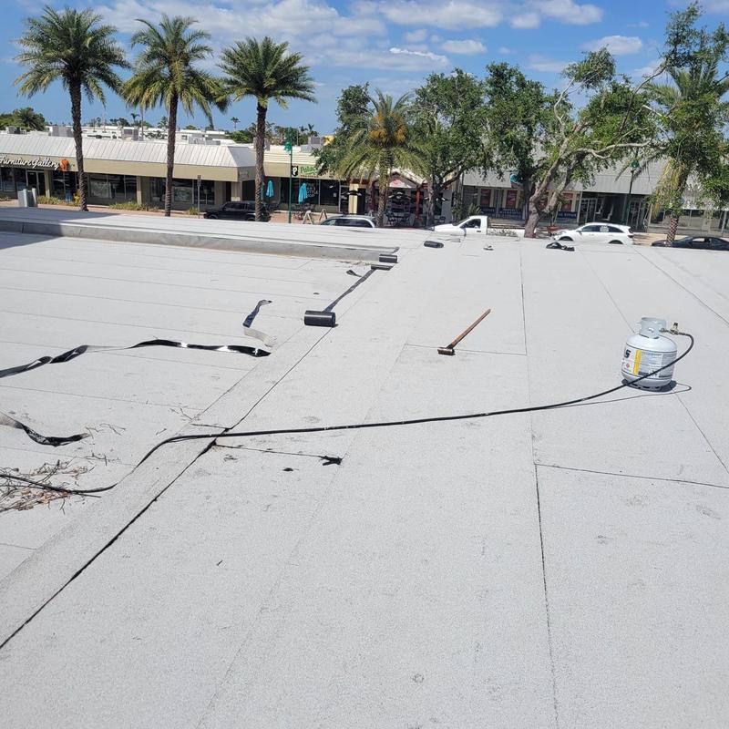 Modified bitumen flat roof with repair tools and materials