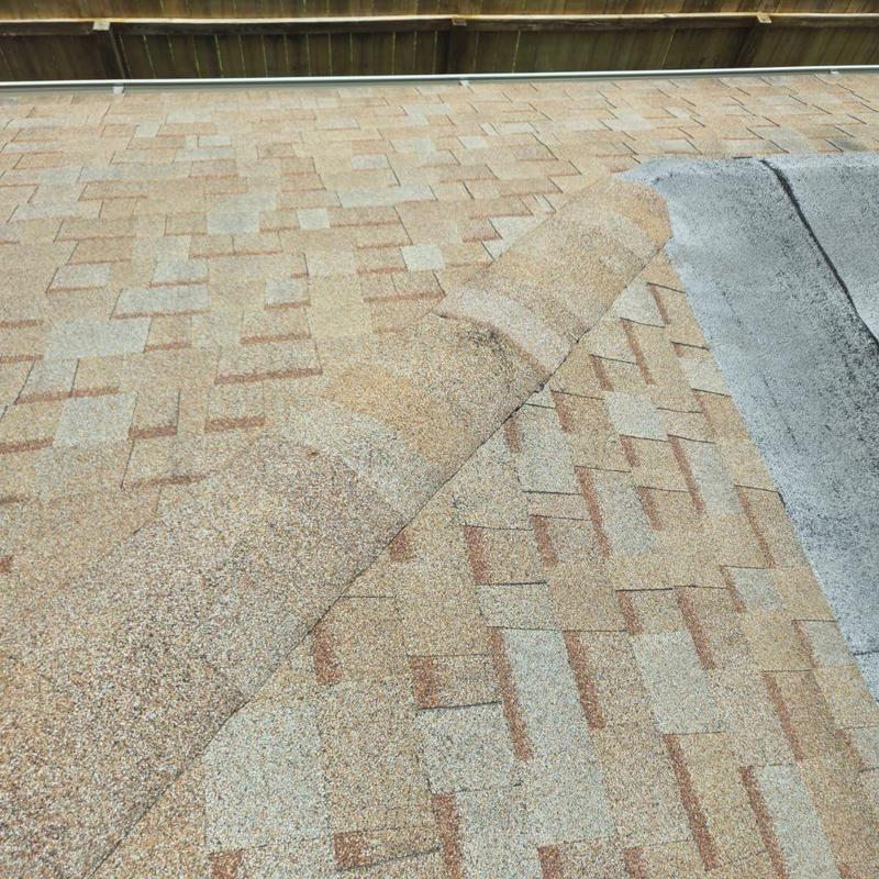 Shingle roof with corrected vent flashing and new shingles