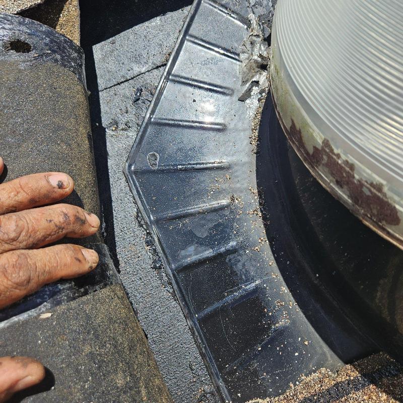 Roof vent flashing with shingle roofing tiles and hand