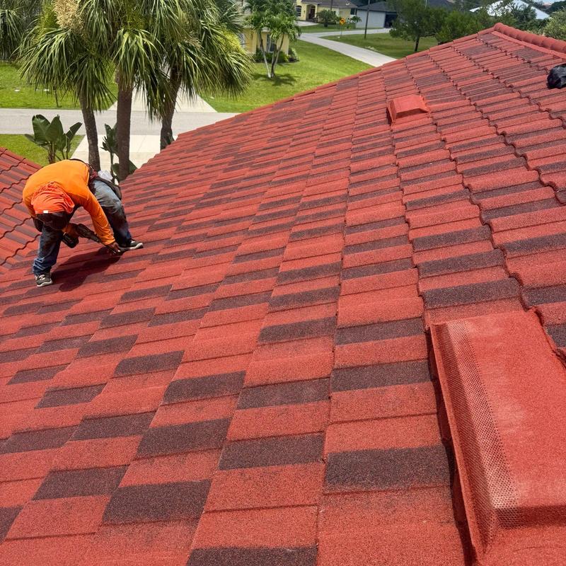 Stone coated steel roof tiles installation on garage