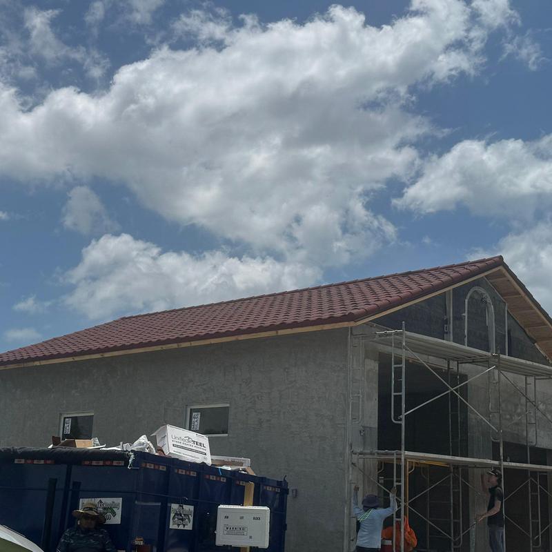 Stonecoated steel roof installation on garage addition