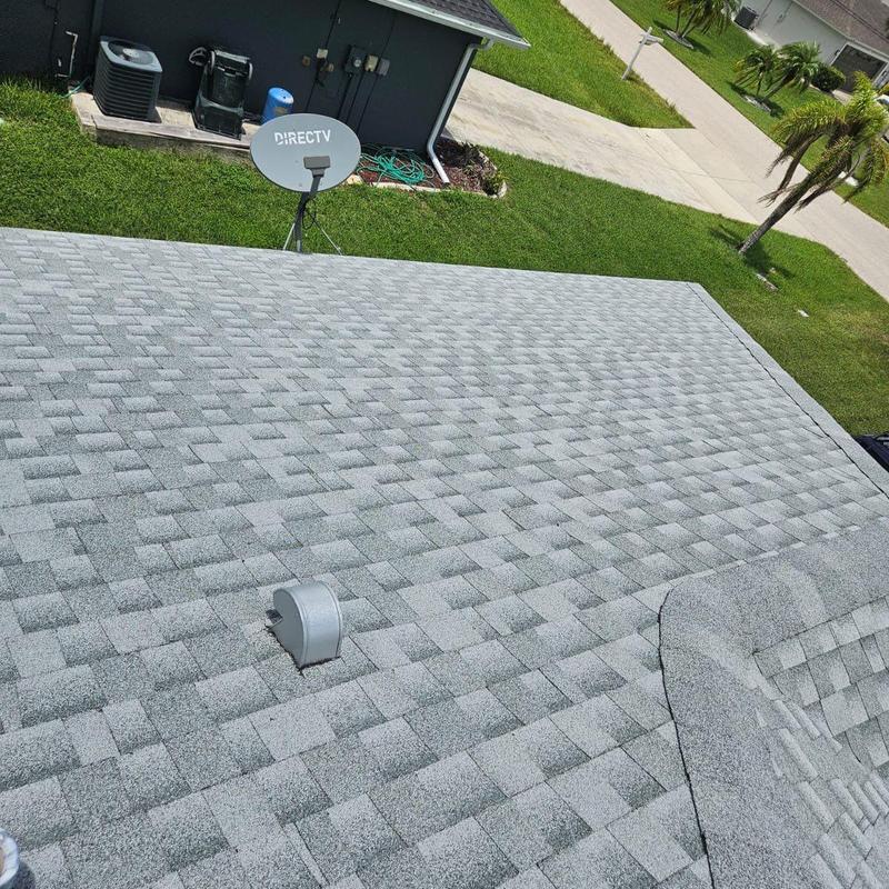 Shingle roof with vent pipe and satellite dish
