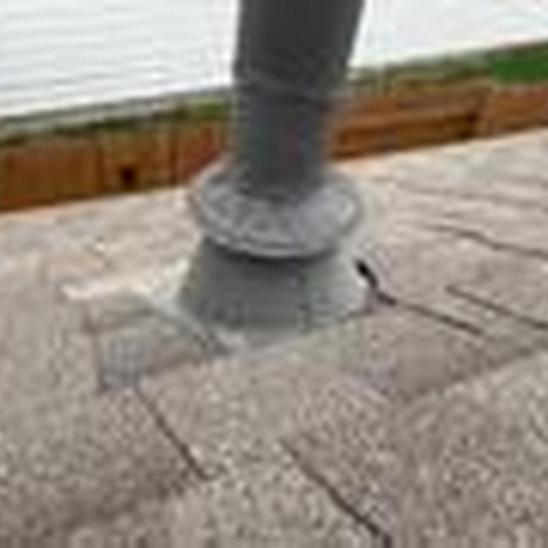Heater vent stack collar with roofing shingles and flashing