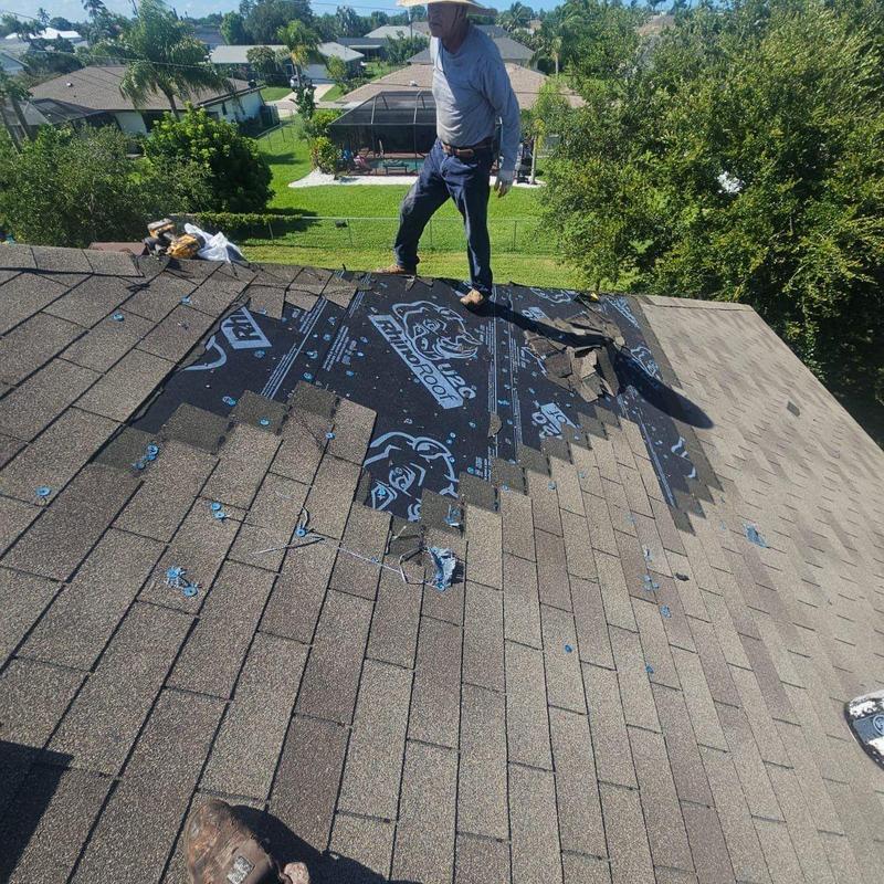 Shingle roof with plywood repair in progress